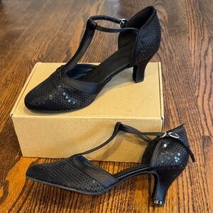 Black satin sequin open sides ankle strap almond toe heels. Size 8M.